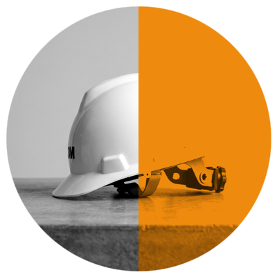 Safety First - White hard hat safety equipment on amber split circle